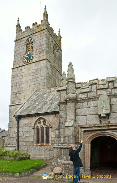 St Just Church - me pointing to an ancient sundial 