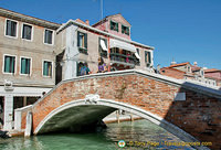 Like in Venice, many little bridges criss-cross the canal in Murano