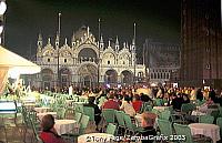 Crowds enjoying drinks and music in Piazza San Marco