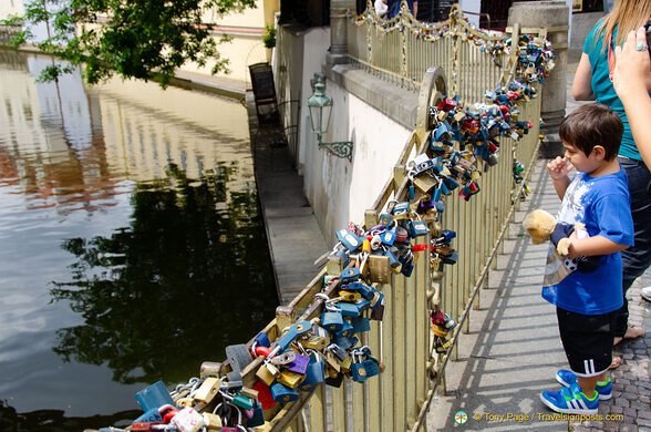 Lovers' padlocks adorn this railing near Charles Bridge
