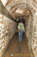 Tony walking through the Catacombes galleries