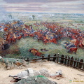 Smoke from the Prussian batteries in the background