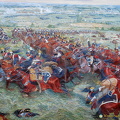 Smoke from the Prussian batteries in the background
