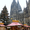 Cologne Weihnachtsmarkt set against the cathedral and its Christmas tree