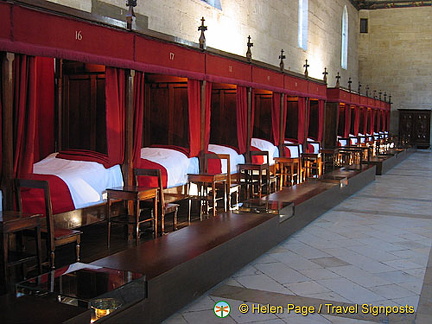 Row of four-poster beds