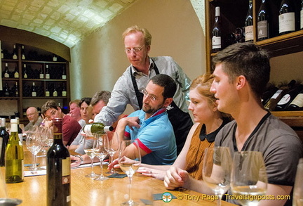 Wine tasting in the 17th century cellar vault of O'Chateau