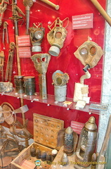 A collection of gas masks and gas bombs