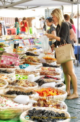 Buying some sweet treats at the Santo Spirito market