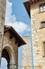 View of Antony Gormley's man on the San Gimignano tower