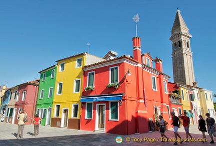 Bright buildings near the leaning bell tower