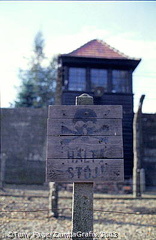 A warning sign at the camp fence