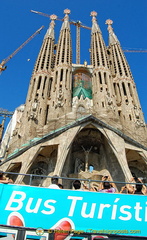 A tourist bus going past the Sagrada Familia