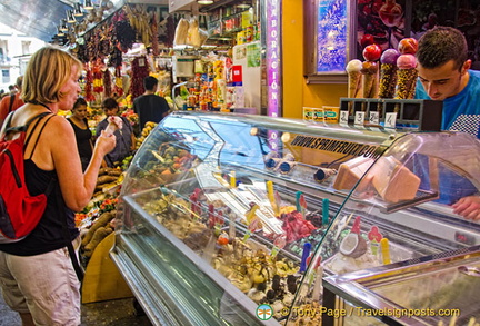 A visitor having some gelatos at La Boqueria