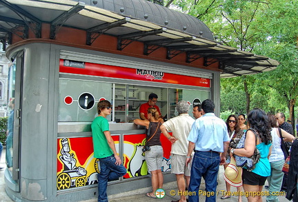 Tourists buying their Madrid sightseeing tour