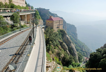 The building on the cliffside is the cable car station