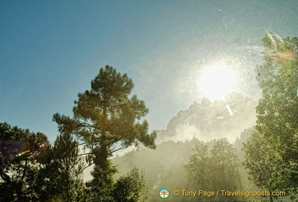 Morning sun breaking through the clouds on the road to Montserrat