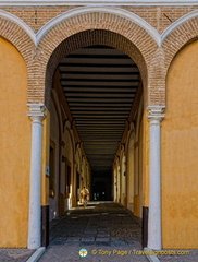 Tuscan columns support the brick arches