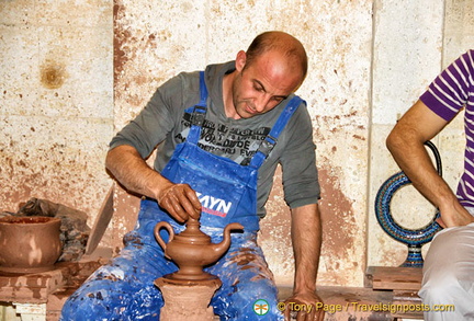 Putting final touches to the teapot