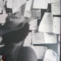 Checking the message board of the Pudding Shop