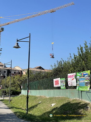 Crane hauling an excavator