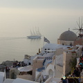 Oia-Sunset scenery (803 visits) Sail ship, windmills, Greek Orthodox church, Greek flag, elements of all things iconic in Oia. Oia-Sunset scenery