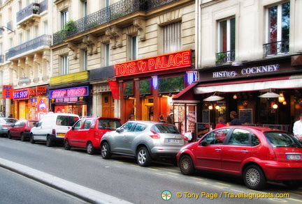 The bright neon signs along Boulevard de Clichy